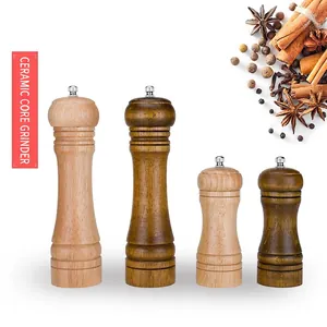 Manual wooden pepper grinders with ceramic core in light and dark brown finishes