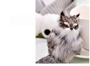 Detailed close-up of fluffy gray and white fox plush keychain with realistic faux fur texture