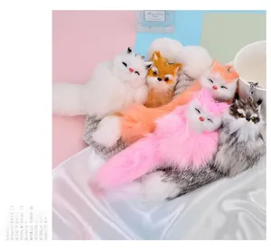 Close-up of soft plush fox charms in multiple colors with metallic chains for bags
