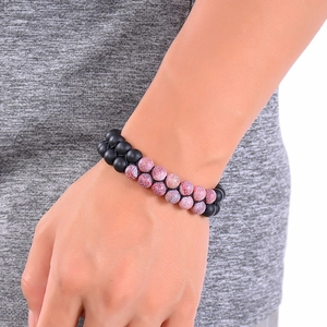 Double-layered beaded bracelet with matte black stones and pink crackle agate beads