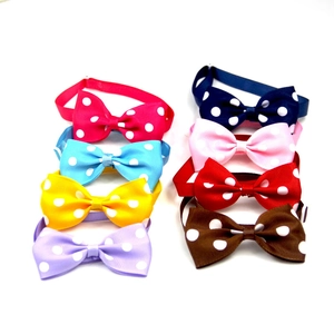 Detailed view of colorful polka dot pet bow ties in eight vibrant ribbed fabric styles