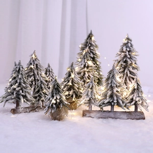 Mini snowy Christmas tree set with warm LED lights and rustic natural wooden bases