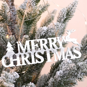 30cm wooden Merry Christmas sign with silver glitter hanging on a snowy tree