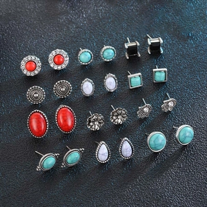 15 pairs of vintage bohemian stud earrings with turquoise and silver floral accents