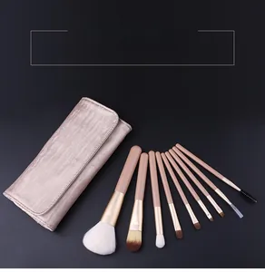 Detail of 8pcs champagne gold makeup brush set with animal hair and leather pouch