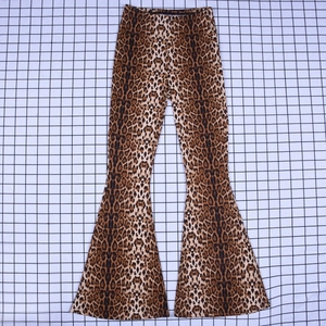 Detail shot of the elastic high waist and leopard print fabric on flare trousers