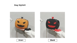 Detail view of pumpkin crossbody bags with bat charms and gold chains in brown and black