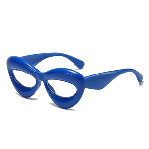 Royal blue cat-eye glasses frame with thick chunky plastic design in a 45-degree side view