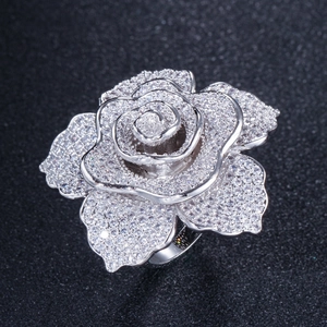 Macro shot of rose flower ring with pavé set white cubic zirconia in silver finish
