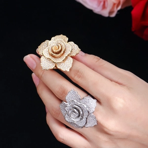 Detailed close-up of a glamorous multi-layered rose ring with sparkling zircon pavé