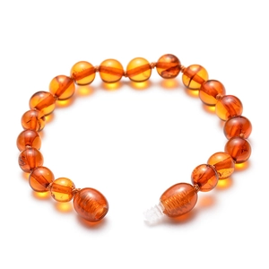 Natural Baltic amber beaded bracelet for babies with secure screw clasp on white background