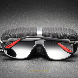 Detail of polarized sunglasses with black and red frame and textured mesh case