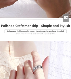 Detailed view of polished stainless steel spinner ring with woven chain texture surface