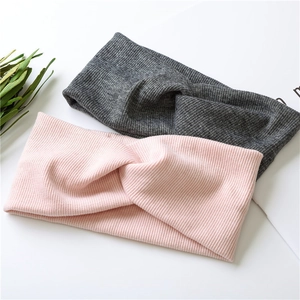 Pink and dark grey knitted twist headbands with ribbed texture for women