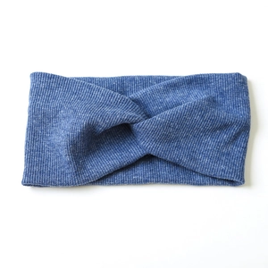 Blue ribbed knit headband for women with a criss-cross knot design in a casual style