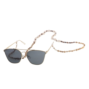 Minimalist gold sunglasses with handmade woven seashell chain and dark grey lenses