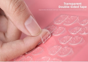 Macro detail of transparent waterproof nail glue tabs showing thin texture and easy peeling