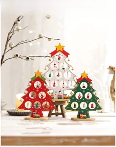 Detailed view of DIY wooden mini Christmas trees with miniature dolls and train bases