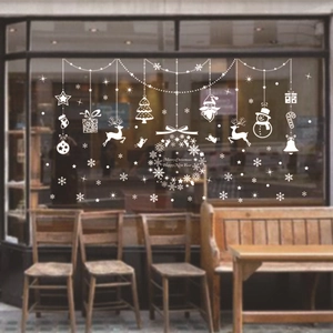 White Christmas window stickers featuring reindeer and snowflakes for festive decor