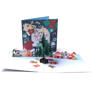 3D pop-up Christmas card featuring a green tree and colorful gift boxes on white background