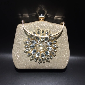 Champagne gold evening clutch bag with crystal sunflower embellishment and chain strap