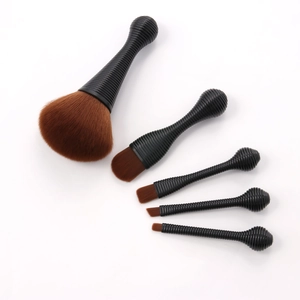 Detailed view of 5-piece makeup brush set with black threaded handles and brown bristles