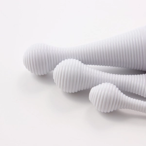 Detailed view of the white spiral silicone texture on the ergonomic massage tool