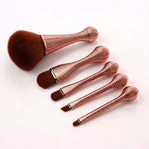5Pcs makeup brush set with rose gold spiral handles and soft brown synthetic bristles