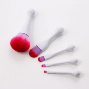 Detail of 5-piece portable makeup brush set with purple gradient bristles and white handles