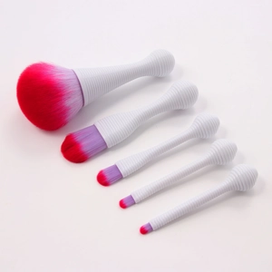 Close-up of 5-piece portable lollipop makeup brush set with purple gradient bristles