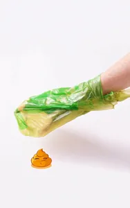 Detail showing the pet waste bag used over the hand for easy cleaning and disposal