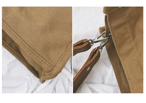 Detail of brown canvas bag featuring premium leather straps and durable metal hardware