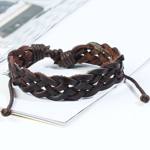 Close-up of retro dark brown braided leather bracelet with adjustable drawstring closure