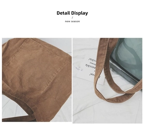 Detail of brown corduroy tote bag showing reinforced stitching and outer pocket texture