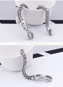 Close-up of silver wheat chain bracelet in titanium steel with a square folding clasp