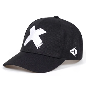 Classic black cotton baseball cap with white X embroidery and side logo on a white background