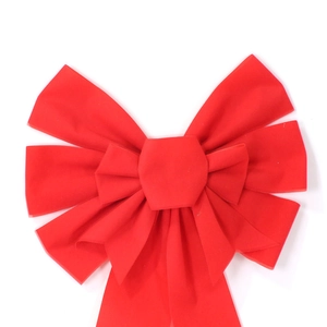 Close-up of red velvet Christmas bow with soft texture for festive home holiday decoration
