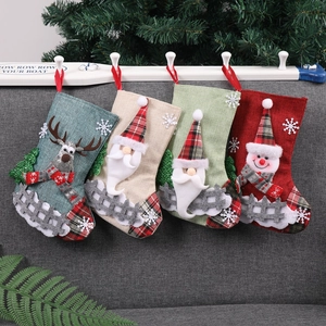 Set of linen Christmas stockings with Santa, Reindeer and Snowman hanging decorations