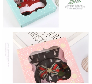 Detailed Christmas hair accessories gift set featuring festive bows and ornaments in boxes