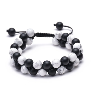 Detailed view of double-row white turquoise and matte black natural stone beaded bracelet