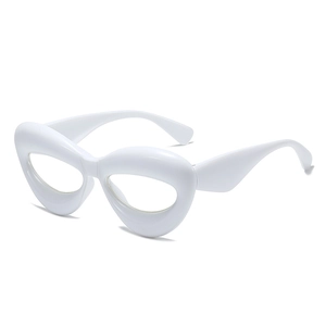 Minimalist white bold cat eye eyewear with thick frame and futuristic geometric silhouette