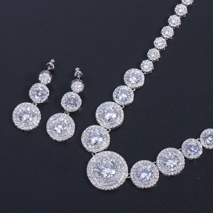 Luxurious silver bridal jewelry set featuring micro-pave zircon necklace and earrings