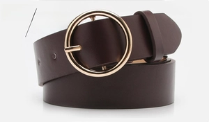 Detailed close-up of dark coffee leather belt featuring a round gold metal buckle