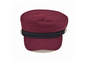 Detail of burgundy wool baker boy hat with black braided rope and silver buttons