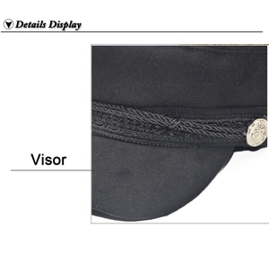 Detail view of the black woolen visor with woven cord and silver anchor button accents