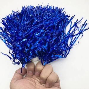 Close-up of vibrant blue metallic cheerleading pom poms with a white plastic handle