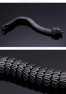 Detail of vintage dragon scale pattern and articulated body of the steel bracelet