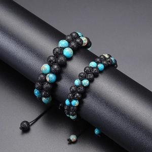 Detail of double-layer volcanic lava stone and turquoise beaded bracelet with adjustable cord