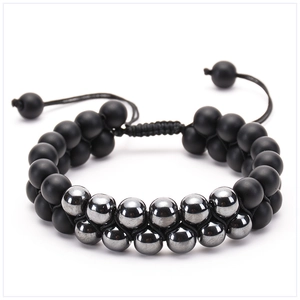 Macro detail of double-row beaded bracelet with matte black and silver metallic stones