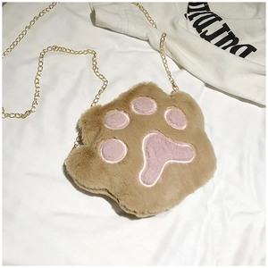 Detailed view of plush cat paw crossbody bag with soft pink embroidery and metal chain